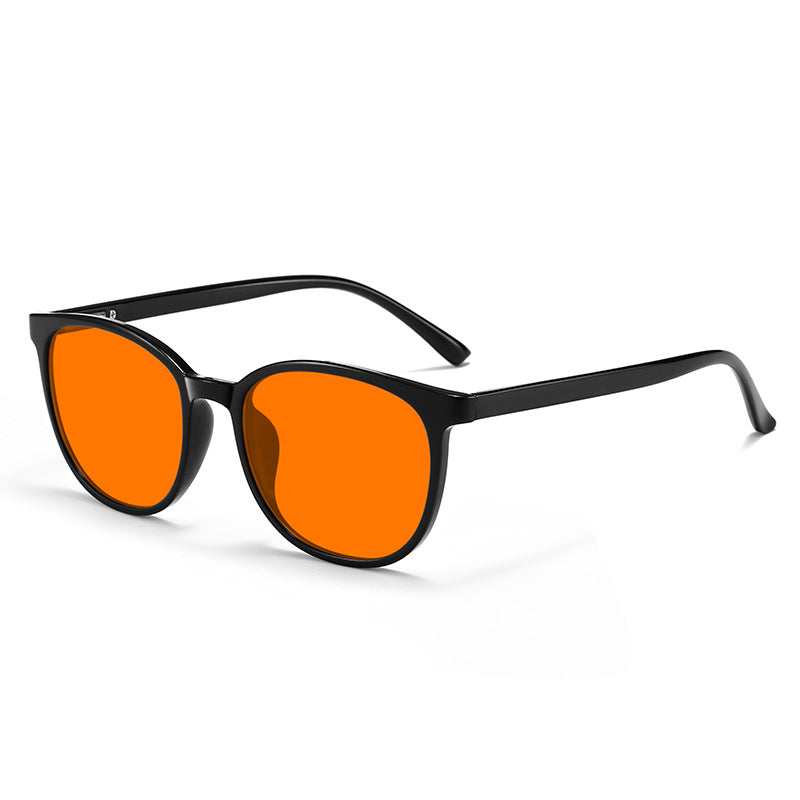 Red-Lens Evening Glasses, Black · Rounded frame, Orange lens